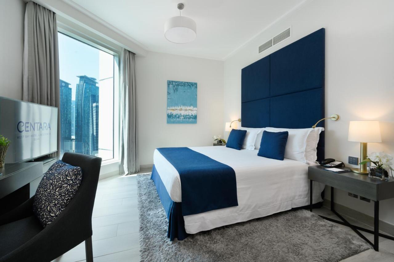 Centara West Bay Hotel & Residences Doha Kültér fotó A bedroom at the Address Downtown Hotel